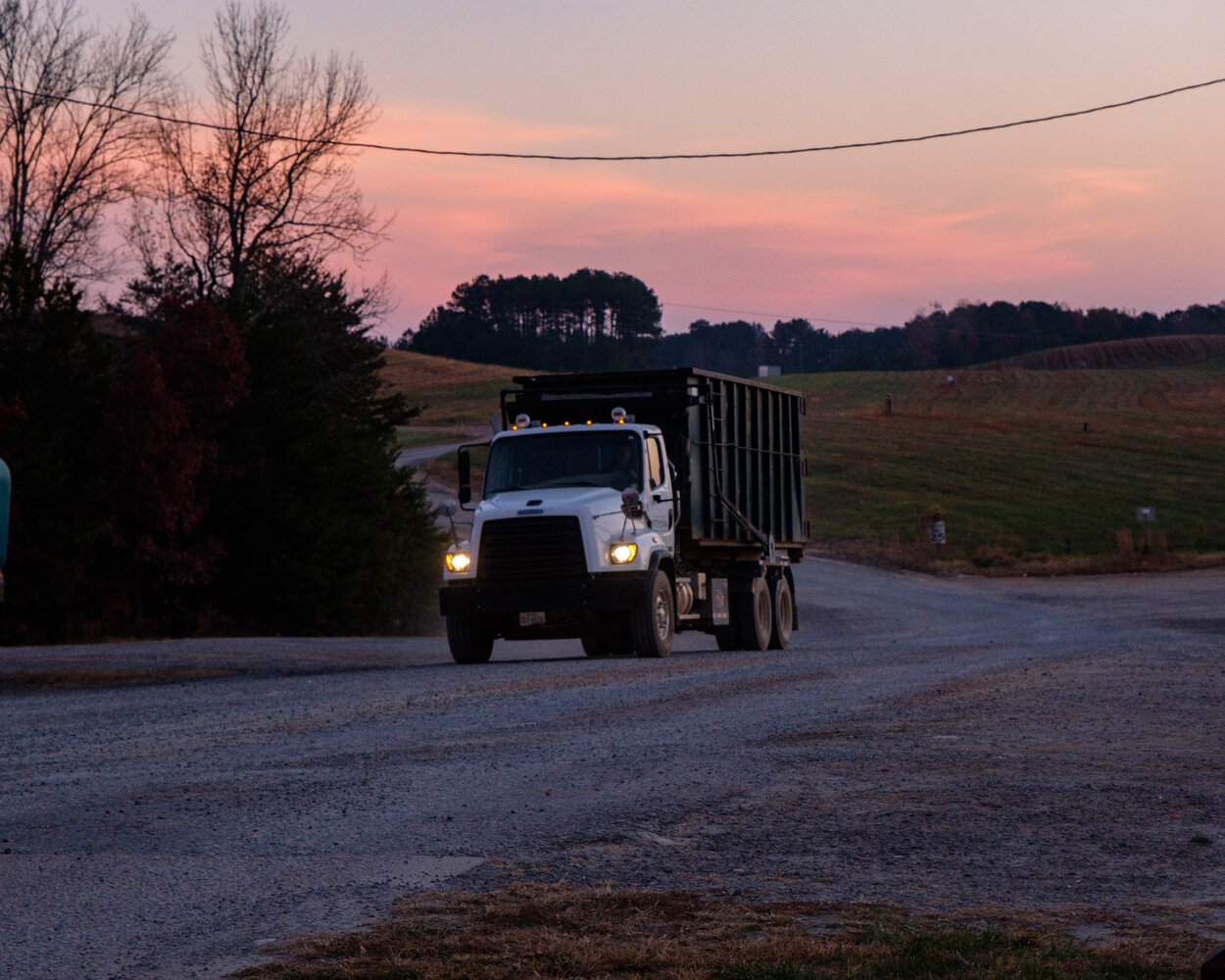 Dump Truck Driving at Landfill