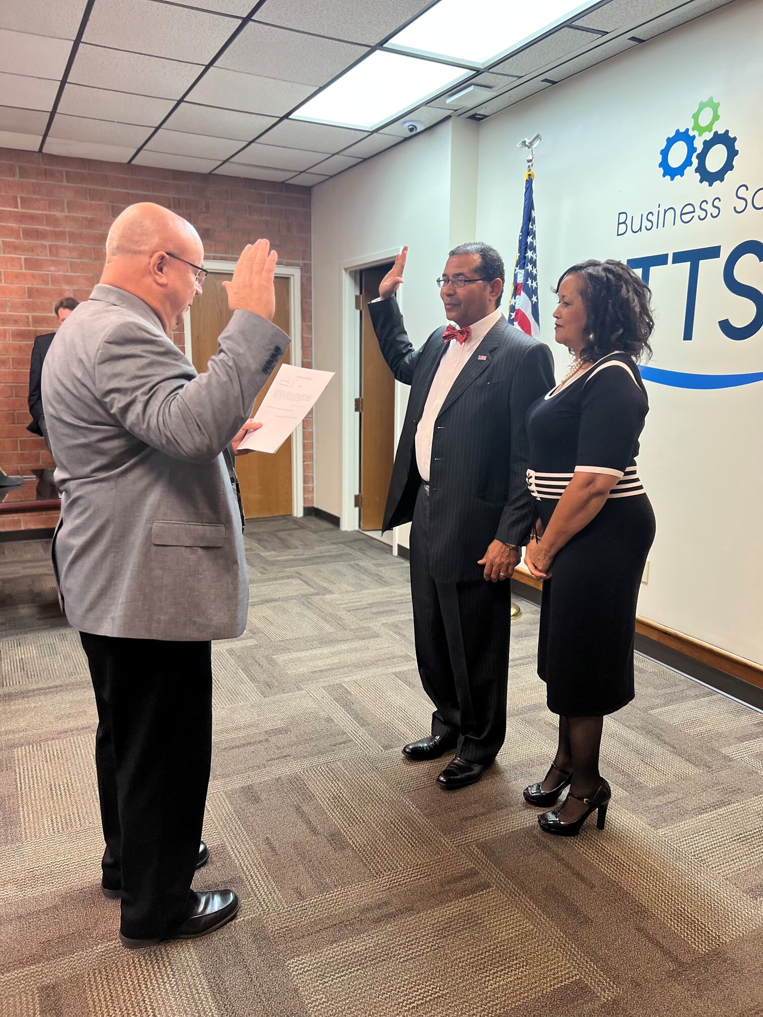 Man holding in hand in the air taking oath