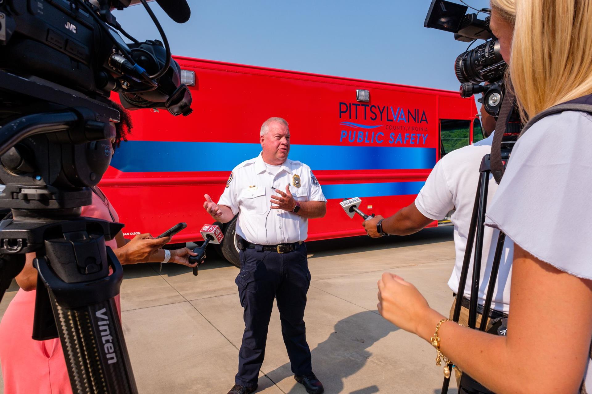 Media Picture - Man Talking to Several Reporters